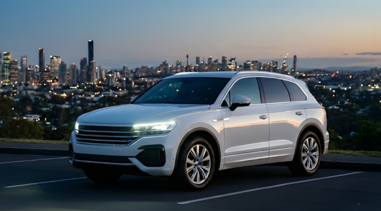 A sleek, white, unbranded SUV parked at a scenic lookout point at twilight/dusk. In the distance, the city lights of an Australian skyline (generic mix of Brisbane/Sydney) are starting to twinkle.