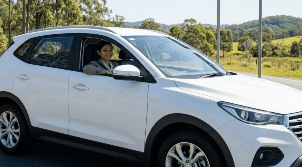 Our diverse young professional woman launching her regional Logan and South East Queensland road trip from the comfort of her clean, white rental SUV.
